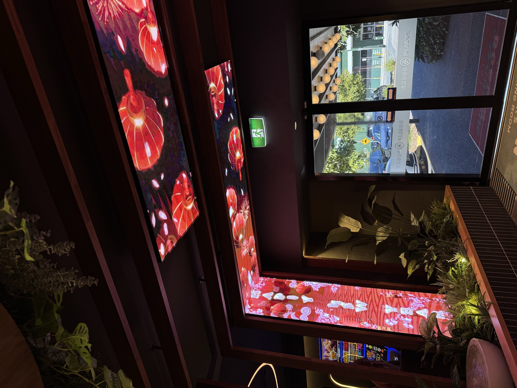 Red lanterns for Lunar New Year on the ceiling panel and a portrait panel beside the entrance doors