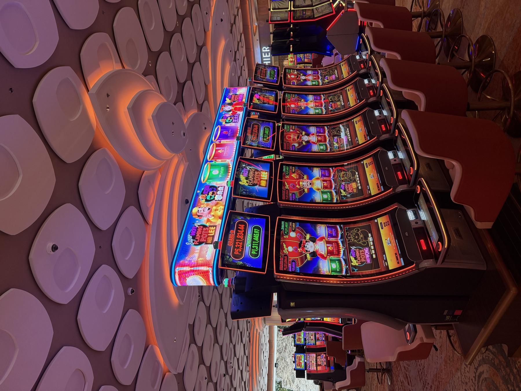 A row of curved LED signs across the floor, each bank with its own